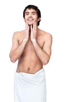 happy young man with the towel around his waist