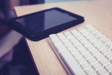 Keyboard and tablet on desk