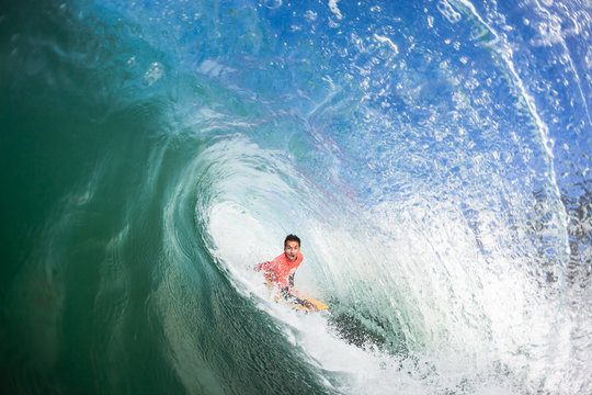 Surfing Bodyboarder Inside Hollow Wave
