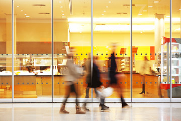 Intentional Blurred Image of Young People in Shopping Center