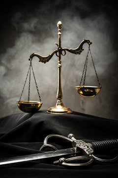 Scales and sword of Justice on a judge's mantle