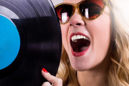 Isolated retro girl holding vinyl LP