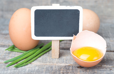 Food preparation concept - broken eggs on cutting board