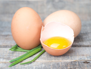 Food preparation concept - broken eggs on cutting board