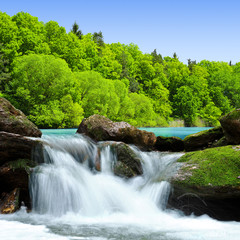Waterfall in spring landscape