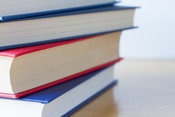 Pile of books on wooden table