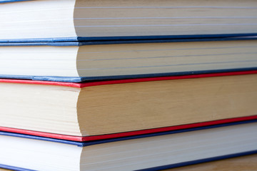 Pile of books on a wooden table