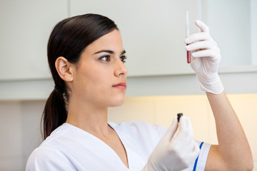 Technician Examining Blood Sample