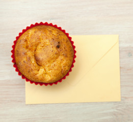 homemade muffin and an envelope