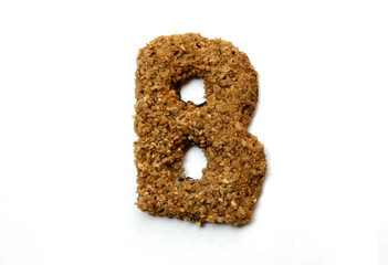Sand letter isolated on white
