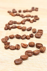 Coffee beans on wooden background