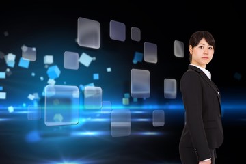 Composite image of serious businesswoman