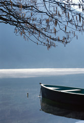 Silhouette of boat on lake