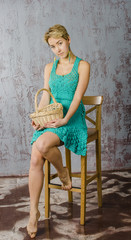 young girl with short hair in a summer dress and basket