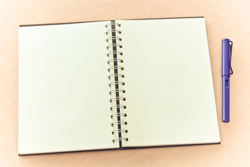 blank notebook and pen