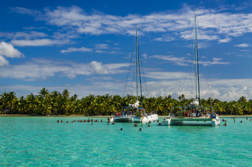 Catamarans on azure water, Caribbean holidays Sanoa Dominicana - obrazy, fototapety, plakaty