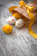 Colorful Easter eggs on wooden background