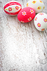 Colorful Easter eggs on wooden background