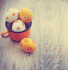 Colorful Easter eggs on wooden background