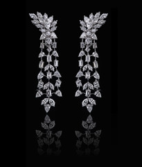 Diamond Earrings on a black reflective background