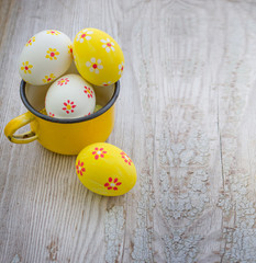 Colorful Easter eggs on wooden background