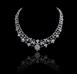Diamond necklace shot against a black background © Ramzi
