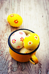 Colorful Easter eggs on wooden background