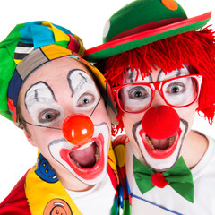 clowns lachen begeistert in die kamera