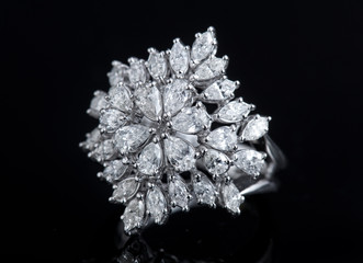 Diamond ring shot on a black reflective background © Ramzi