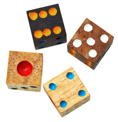 four wooden gambling dices close up isolated