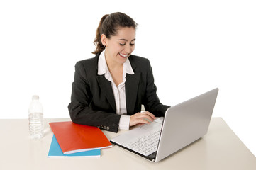 happy business woman smiling working on her laptop