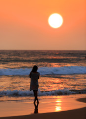 girl's silhouette on sunset