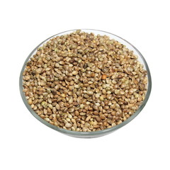 glass bowl full of hemp seeds isolated on white background