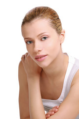 Young woman in night wear sitting on floor