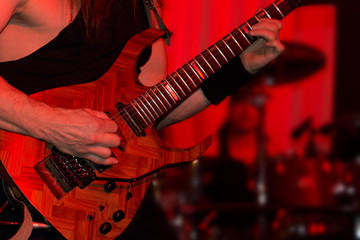 Lead guitarist playing electric guitar in a band