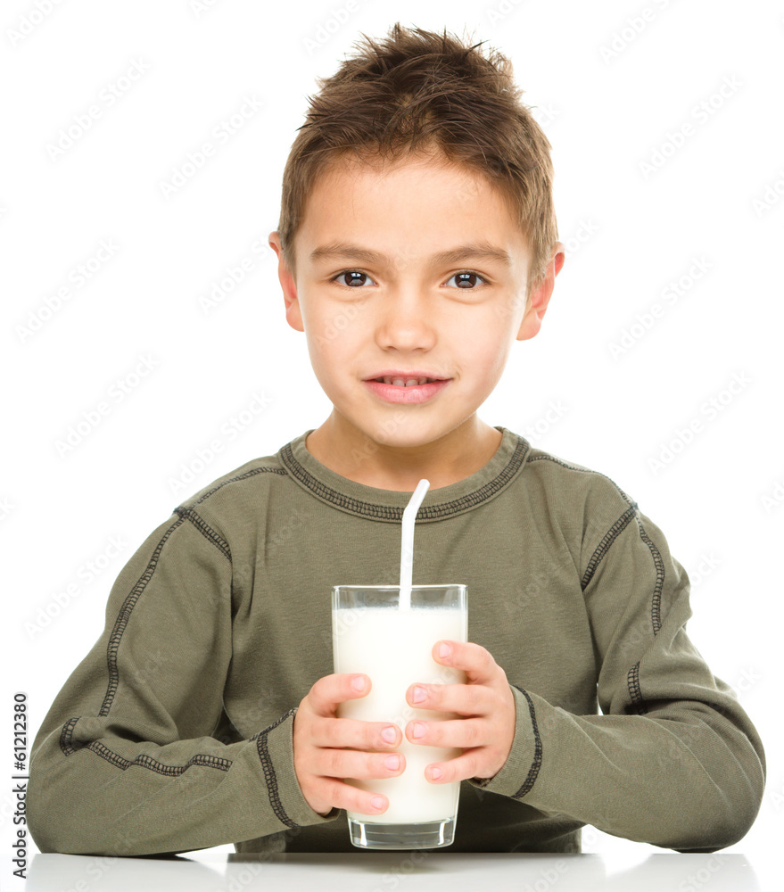 Wall mural Cute boy with a glass of milk