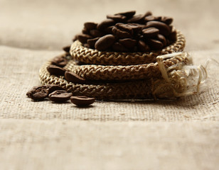Fototapeta na wymiar Coffee beans on a linen textute.