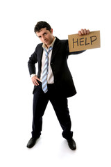 stressed business man holding help sign