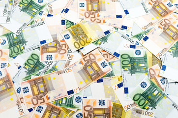 Many euro banknotes making european currency background