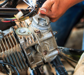 Fototapeta premium Technician is fixing a part of motorcycle