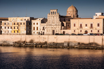 Italian houses on coast view from waterfront, near castle Syracu