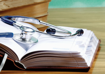 Stethoscope with reference books.