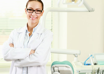 woman dentist at her office smiling