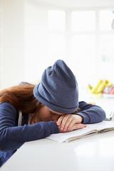 Fototapeta na wymiar Depressed Girl Studying At Home