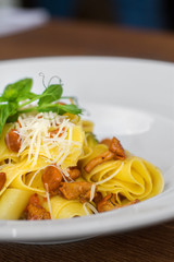Image of pasta with chanterelle served in white dish