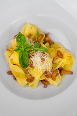 Image of pasta with chanterelle served in white dish