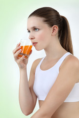 woman drinking orange juice vitamin