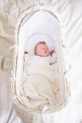 Fototapeta na wymiar Newborn Baby Girl Sleeping In Cot