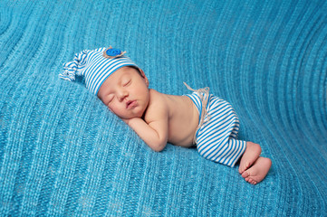 Sleeping Newborn Baby Wearing Striped Pajamas