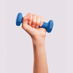 Hand with blue dumbbell